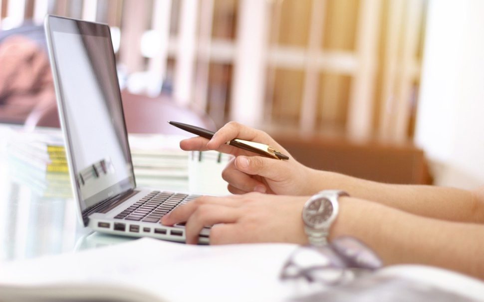 person typing on a laptop