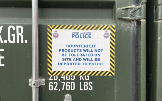 Image of a sign on a container warning that counterfeit products cannot be stored by tenants.