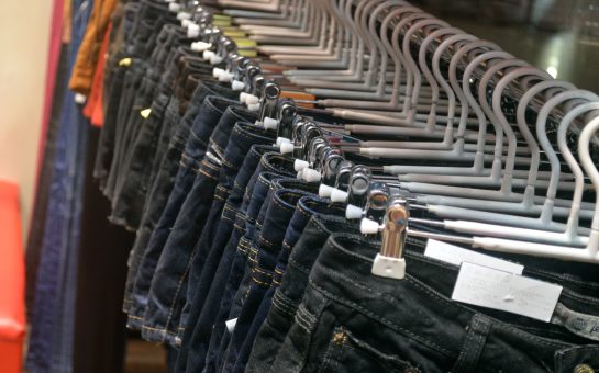 The image shows a rack of jeans