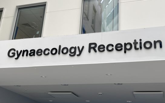 An image of a sign saying "Gynaecology Reception"